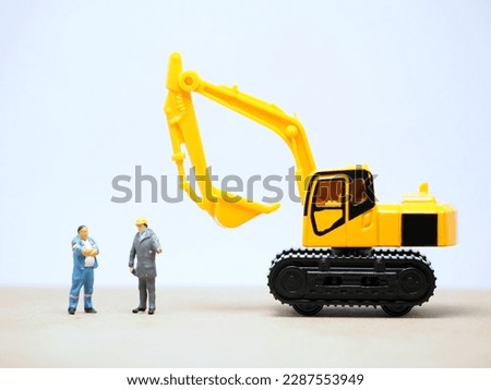 Mini toy at table with white background.