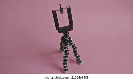 Mini Tripod On Pink Background