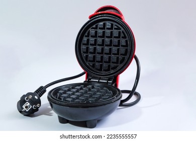 Mini waffle maker isolated on white background - Shutterstock ID 2235555557