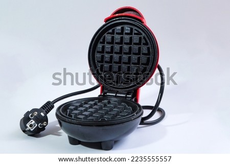 Mini waffle maker isolated on white background