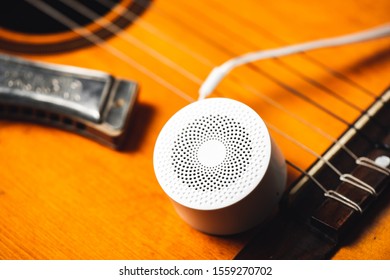 mini wireless portable bluetooth speaker for music listening. Voice assistant speaker at home.