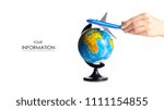 Miniature airplane in hand globe travel pattern on white background isolation