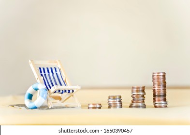 Miniature Beach Chair with Increasing Stacks of Coins
