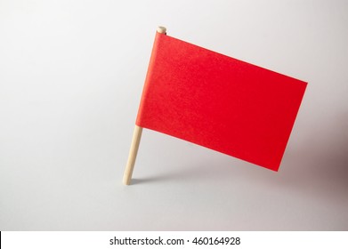 Miniature Blank Red Flag. Ready For A Message. Paper Flag Isolated On White Background.