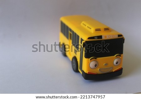 miniature bus in yellow. one of the children's toys