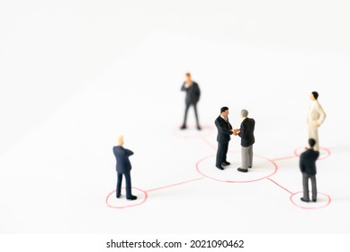 Miniature Businessman Shake Hand Partner Client Customers On Organization Sign With Success Dealing Business Using As Contract Commitment Agreement Investment And Partnership Business Development Join