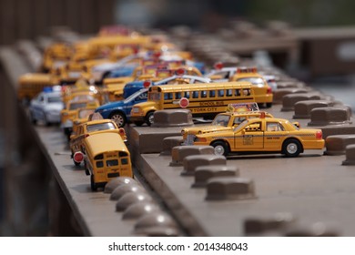 Miniature Cabs And School Buses In NYC.