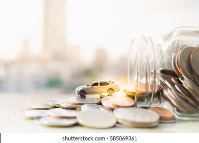 Miniature car model and Financial statement with coins. Finance and car loan, saving money for a car or material design  concepts.