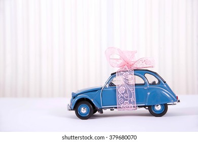 Miniature Car With Pink Ribbon