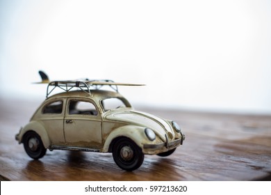 Miniature car with surf board - Powered by Shutterstock