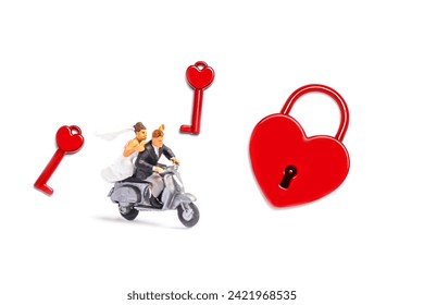 miniature couple with heart shape padlock isolated on white background.