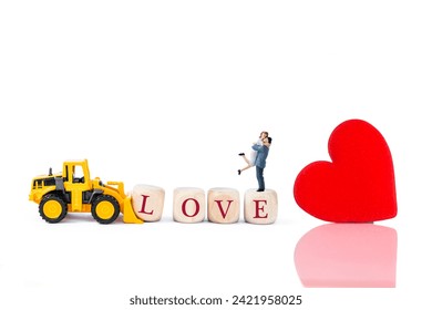 Miniature couple on love wooden cube with red heart, love and romance concept, valentine background idea - Powered by Shutterstock