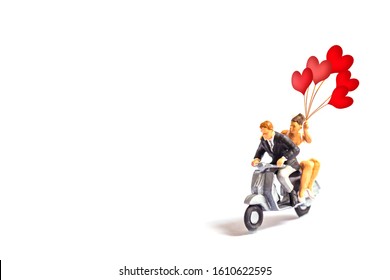 miniature couple with red heart shape balloon isolated on white, Image for Love couple and Happy valentine day concept. - Powered by Shutterstock