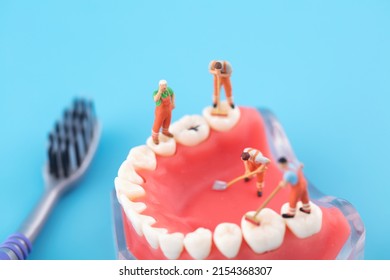 Miniature Creative Worker Cleaning Mouth And Teeth