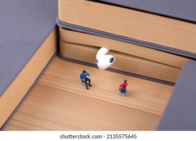 Miniature creativity to enjoy listening to books education - Shutterstock ID 2135575645
