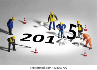 Miniature engineer or technician change represents the new year 2014- 2015 - Shutterstock ID 233301730