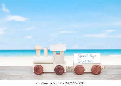 miniature figure wood train toy carry block text over summer beach background. - Powered by Shutterstock