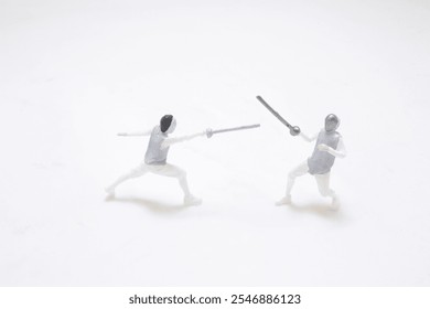 miniature figures capture the dynamics of a fencing duel, showcasing precision - Powered by Shutterstock