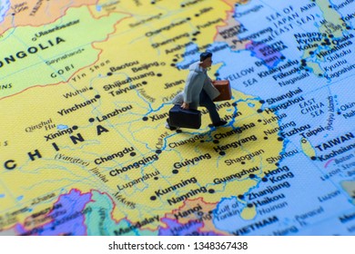 Miniature Figurine Concept : The Businessman Traveling / Standing On MAINLAND CHINA Map Travel Around The World, Business Trip Traveler Adviser Agency Or Online World Wide Marketing Concept.