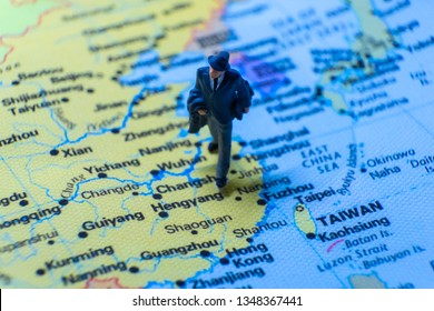 Miniature Figurine Concept : The Businessman Traveling / Standing On MAINLAND CHINA Map Travel Around The World, Business Trip Traveler Adviser Agency Or Online World Wide Marketing Concept.