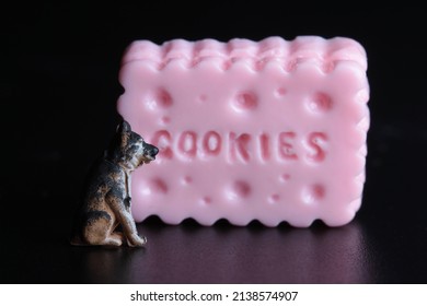 Miniature Figurine Of A Dog With A Giant Cookie