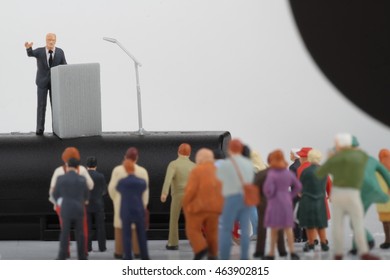 Miniature Figurine Of A Politician Speaking To The Crowd During An Election