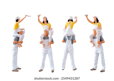 Miniature figurine of two painters, with one perched on the other's shoulders, isolated on white background with clipping path - Powered by Shutterstock