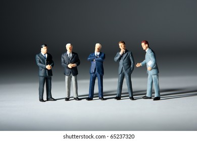 Miniature Figurines Of Successful Business Team. Five Statuettes