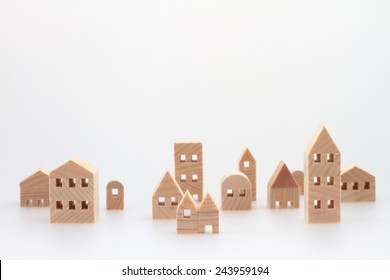 Miniature house on white background - Shutterstock ID 243959194