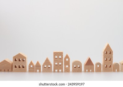 Miniature house on white background - Shutterstock ID 243959197