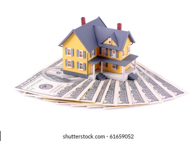 Miniature House Over Money Isolated On White Background