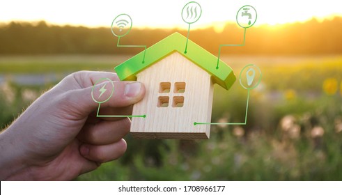 Miniature house and symbols of public utilities. Choosing a home to buy, assessing the cost and condition of the building. Location in the city. Repair and renovation, maintenance services. - Shutterstock ID 1708966177