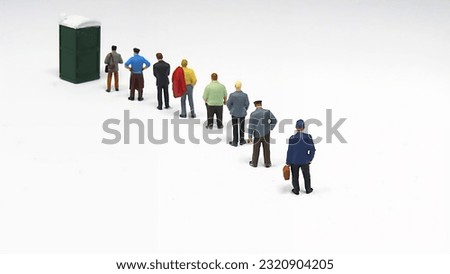 Miniature Men Standing in Long Line for Chemical Toilet.