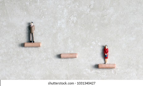 Miniature Men And Women. Glass Ceiling Problem Concept.