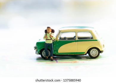 Miniature model man backpacker with car on map, traveling and planning concept - Shutterstock ID 1375885940