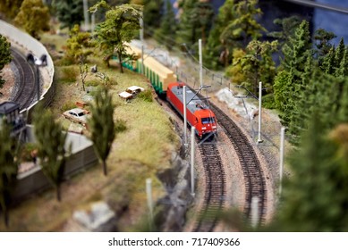 A Miniature Model Of The Train Follows The Forest Road