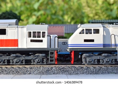 Miniature Model Train With Several Locomotives And Carriages