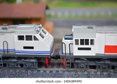 Miniature Model Train With Several Locomotives And Carriages