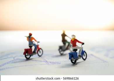 Miniature motorcycle / bigbike people riding passport book with copyspace, Travel around the world, explore the earth, adventure trip and travels insurance background Concept.