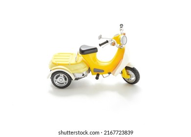 Miniature Motorcycle Isolated On White Background. Motorcycle Toy Model. Kids Toy. Toy Collector. Vintage Motorcycle. Packshot Photography.