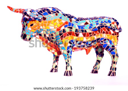 Miniature multicolored statue of bull in Gaudi style - traditional souvenir from Barcelona(Spain) . This is not art object, only inexpensive spanish gift. 