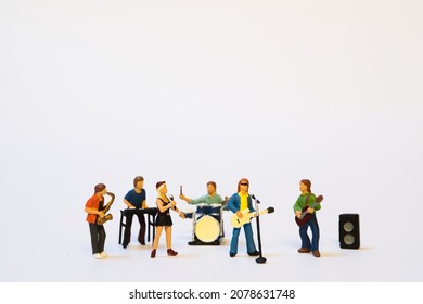 miniature music band on white background - Shutterstock ID 2078631748