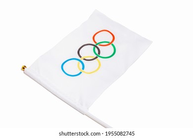 Miniature Olympic Flag On A White Background. Olympic Games Symbol. Moscow Russia 7 April 2021