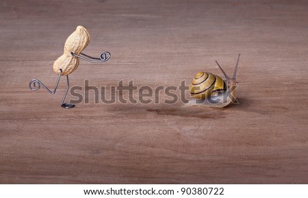 Miniature with Peanut Man trying to catch a Snail