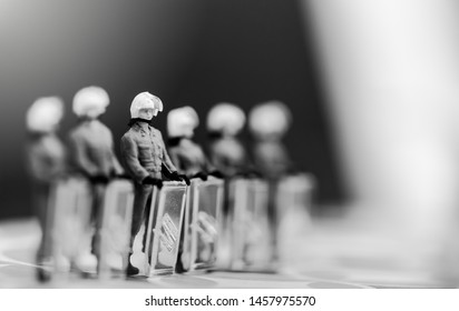 Miniature People : Anti Extradition Bill Protest.Riot Police Bunch Up Next To A Cloud During Clashes With Protesters On White Background.Black Lives Matter.No Racism End Racism.Curfews Defied In US.