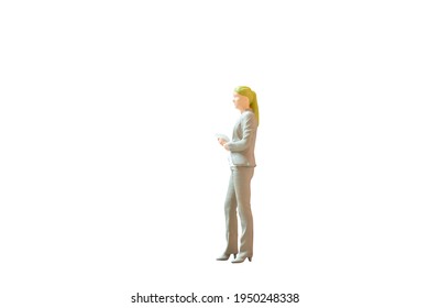 Miniature people Business Woman standing on white background with clipping path - Shutterstock ID 1950248338