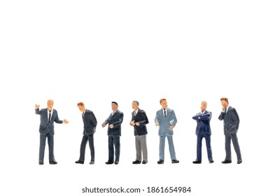 Miniature people, Businessman standing on white background