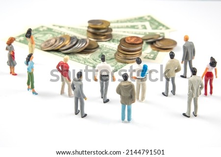 miniature people. businessman stands near dollar money. investments and earnings for work