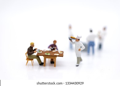 Miniature People: Chefs Are Cooking For Customers Who Are Waiting For Service. Image Use For Quick Service, Food And Beverage, Business Concept.