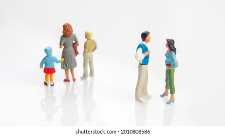 miniature people. concept of family people in relationships on a white background. the problem of fidelity in marriage. raising children in problematic relationships in the family - Shutterstock ID 2010808586